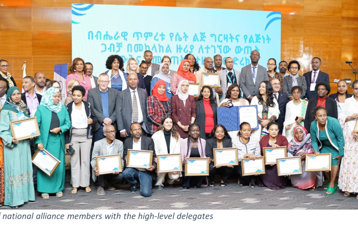 A group photo of national alliance members with the high-level delegates